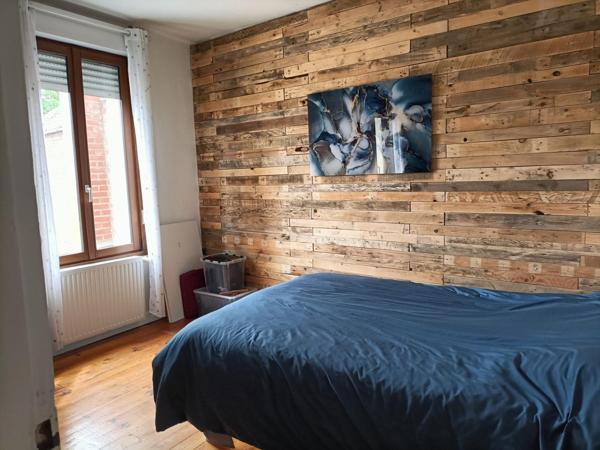 maison mitoyenne avec du potentiel et chaleureuse