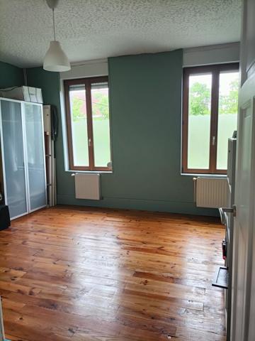 maison mitoyenne avec du potentiel et chaleureuse