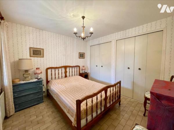 Maison familiale 4 chambres avec jardin arboré et grand garage