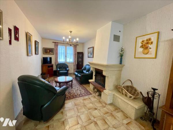 Maison familiale 4 chambres avec jardin arboré et grand garage