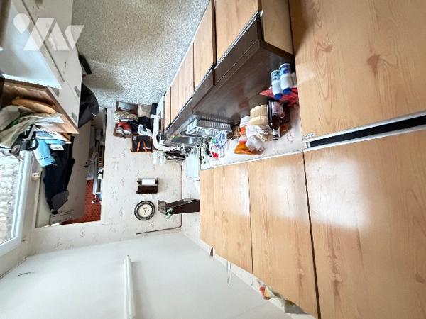 Maison mitoyenne et 2 garages