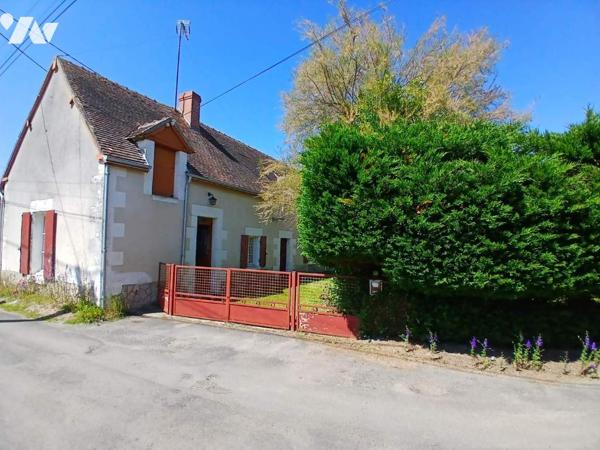 Maison à restaurer avec jardin et garage