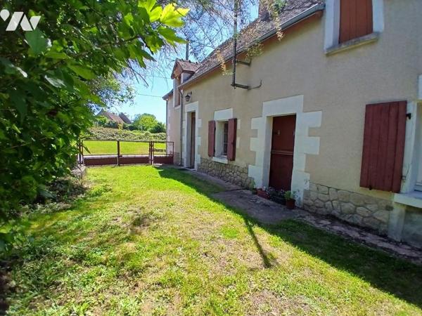 Maison à restaurer avec jardin et garage