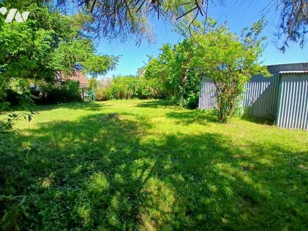 Maison à restaurer avec jardin et garage