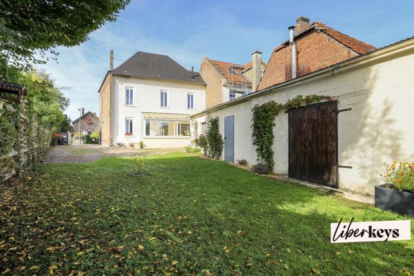Maison 4 chambres, 180 m² avec local commercial loué, cour, jardin et potentiel d’aménagement