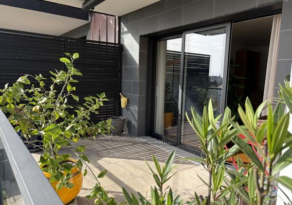 Bel appartement T4 de 106.46 m² avec balcons et garage dans une résidence de standing récente au calme d'une impasse