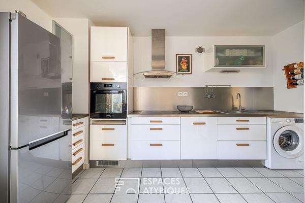 Double hauteur et terrasses en dernier étage à deux pas du Rhône