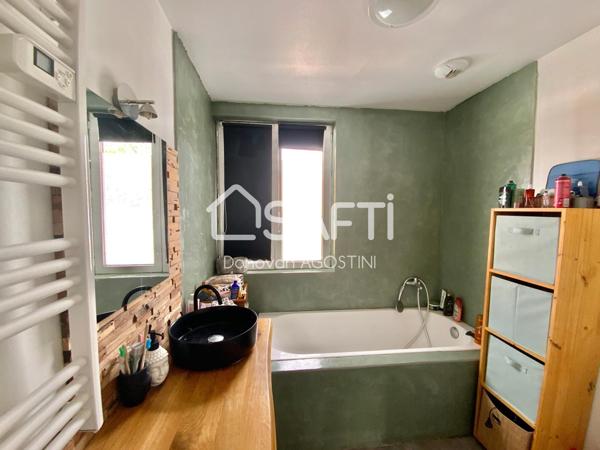 Maison de 119 m² avec 4 chambres, 2 salles de bain et une véranda