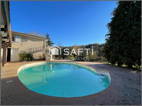 Propriété 1.6 hectares avec étang sur emplacement exceptionnel, maison d'architecte en pierre avec piscine, 6 chambres, dépendances.
