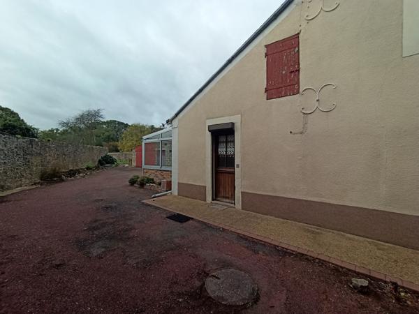 Maison de bourg avec joli terrain