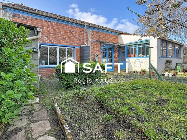 Potentiellement habitation, garage ou atelier avec jardin au centre de Luçon