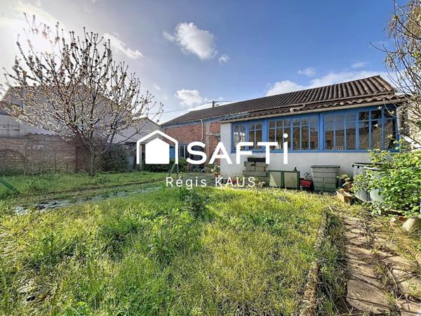 Potentiellement habitation, garage ou atelier avec jardin au centre de Luçon