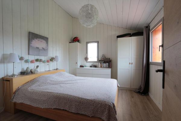 Maison atypique ossature bois avec jardin paysagé