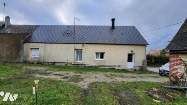 Maison sur 3704 m² avec dépendances en briques.