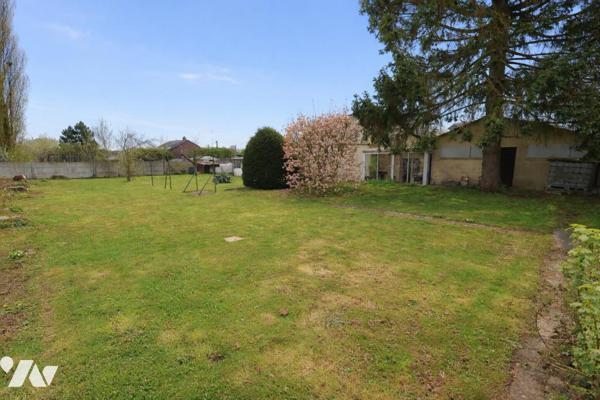 Maison individuelle idéale pour famille ou projet de deux logements – Garage et terrain clos.