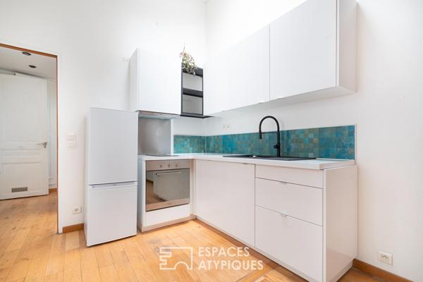 Esprit loft en dernier étage avec poutres apparentes