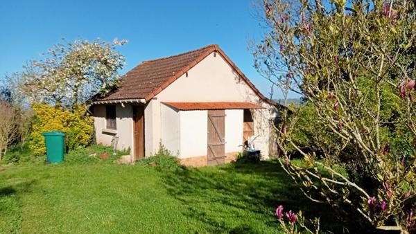 Corps de ferme au grand espace sur vue dégagée.