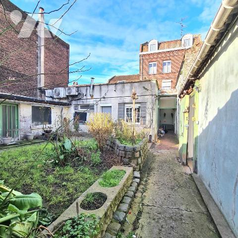 LOOS immeuble à usage commercial et d'habitation avec parking