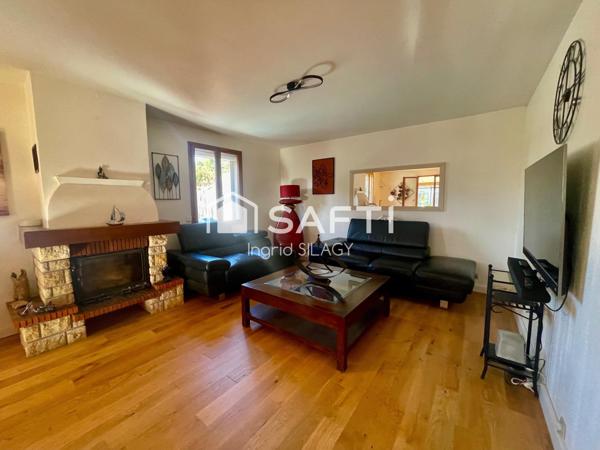 Maison lumineuse avec véranda, piscine et garage