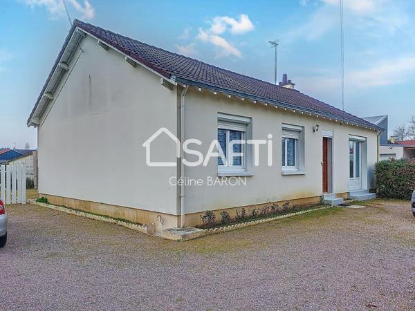 Maison de plain-pied avec garage et jardin arboré