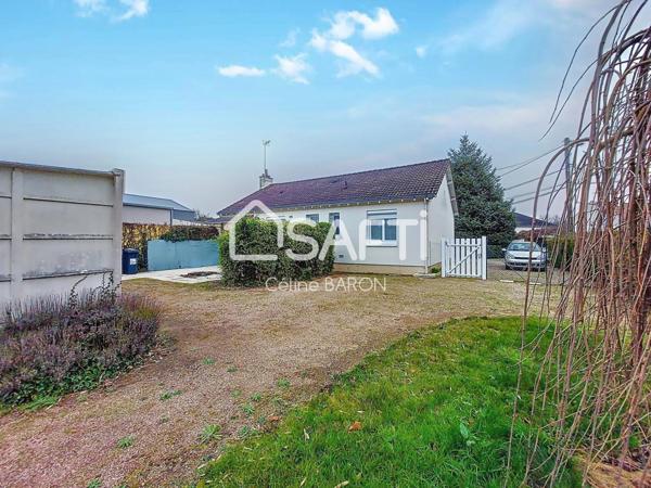 Maison de plain-pied avec garage et jardin arboré