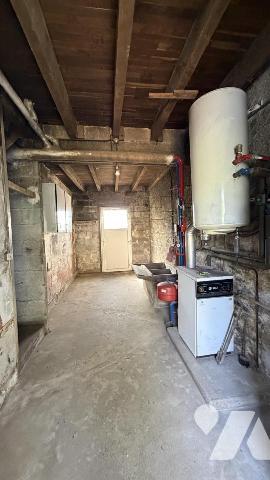 BAUD Entrée de ville: terraine de 1990 m² Ub avec maison à rénover 