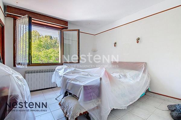 Maison de type 4 d'environ 90m² avec grand sous-sol, garage, terrasse et jardin