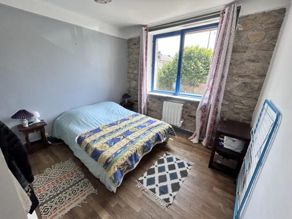 Maison mitoyenne 1 côté Le Mené 70 m²