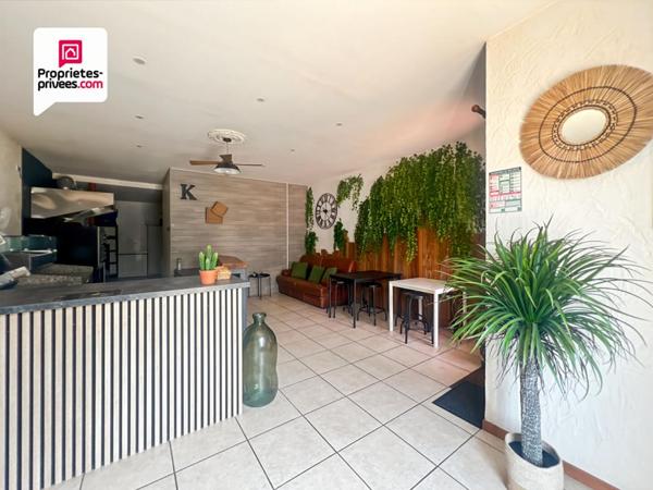 Immeuble en pierre de 156 m² avec local commercial + maison avec jardin