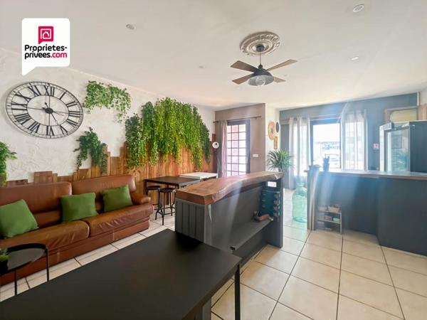 Immeuble en pierre de 156 m² avec local commercial + maison avec jardin