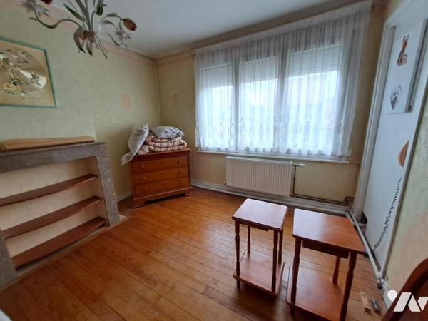 Maison mitoyenne avec  jardin et emplacement de stationnement