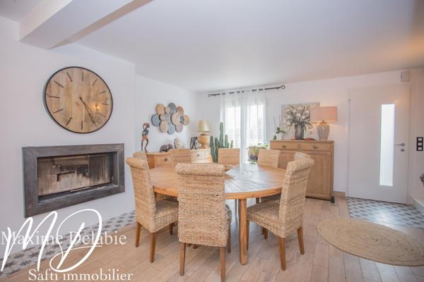 Maison d'architecte à Trangé avec garage attenant : élégance et nature en harmonie