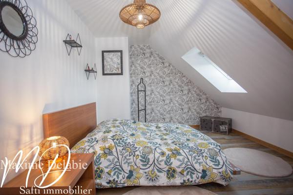 Maison d'architecte à Trangé avec garage attenant : élégance et nature en harmonie