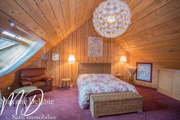 Maison d'architecte à Trangé avec garage attenant : élégance et nature en harmonie