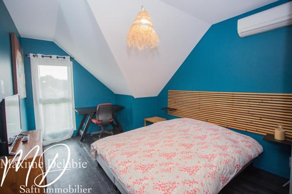 Maison d'architecte à Trangé avec garage attenant : élégance et nature en harmonie