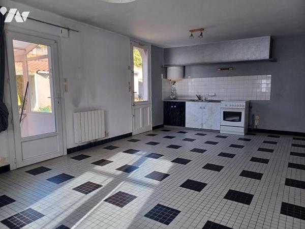 CENTRE -PLAIN-PIED AVEC GARAGE ET JARDIN