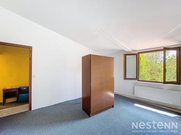 A Vendre Maison de ville en pierre de 123 m² habitable de plain-pied à proximité immédiate des commodités