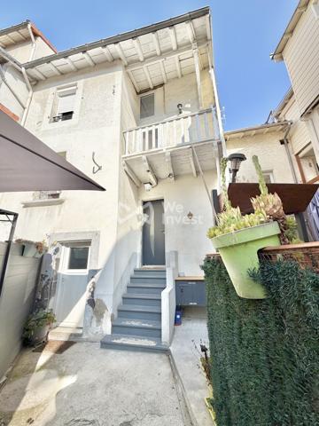 Maison de ville de type 4 avec terrasse et garage pour citadine.