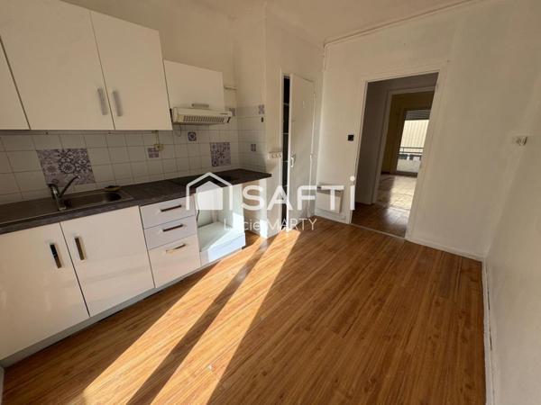 Immeuble 7 appartements avec balcon et cave,