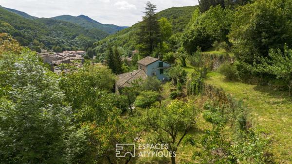 Charme et authenticité d’un ancien moulinage en pierre, avec gite, vue, ruisseau, source en Ardèche