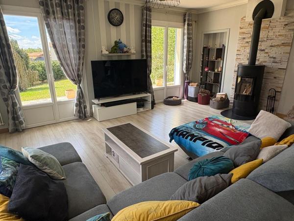 Spacieuse maison avec jardin arboré et double garage