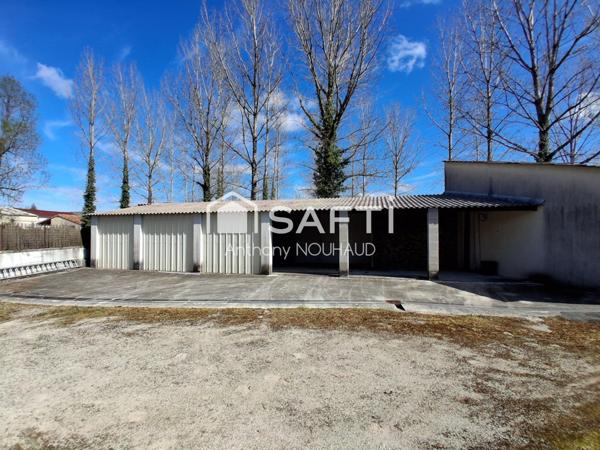 Bien avec 3 chambres, séjour, cuisine, grd garage