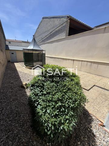 Maison familiale avec 2 garages en centre-ville