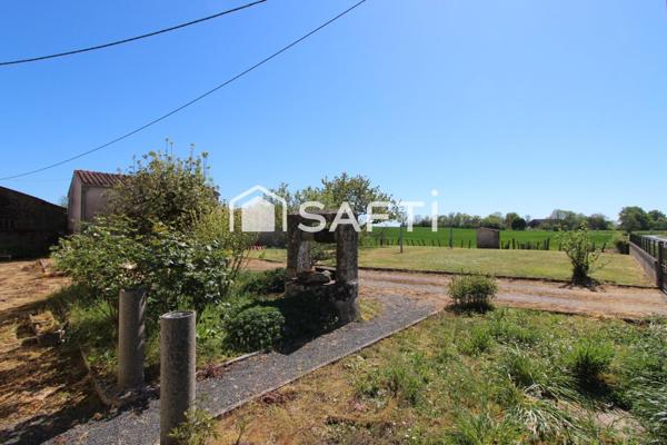 MAISON EN PIERRE AVEC DÉPENDANCES ET TERRAIN