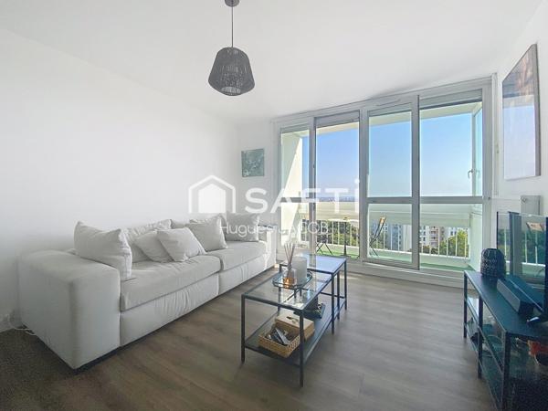 Appartement rénové avec balcon, garage et cave