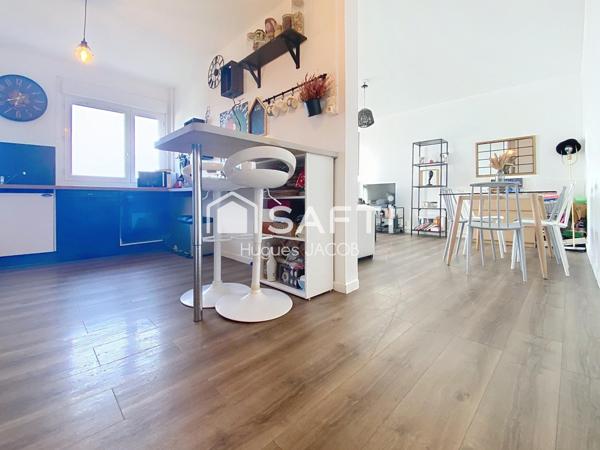 Appartement rénové avec balcon, garage et cave