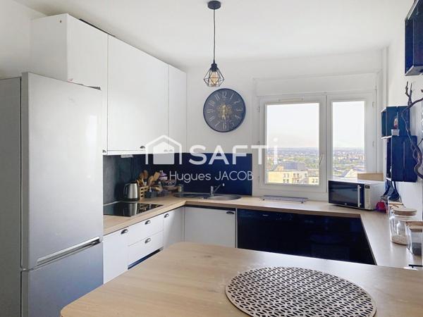 Appartement rénové avec balcon, garage et cave