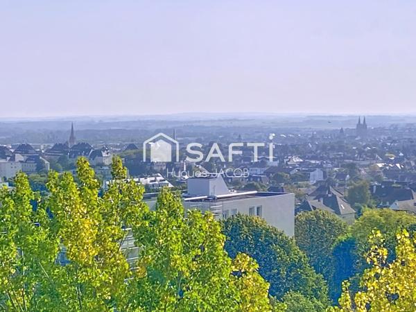 Appartement rénové avec balcon, garage et cave