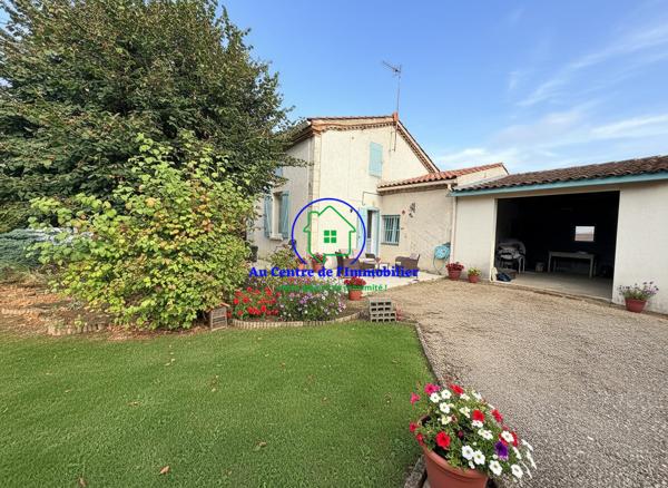 Maison en pierre de plain-pied avec jardin et garage
