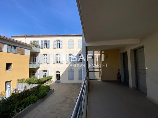 1er étage avec ascenseur et place de parking en centre ville